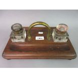 Victorian walnut two bottle inkstand with brass handle