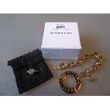 Givenchy Paris gilt metal bracelet together with a Givenchy small double cone magnetic ear stud,
