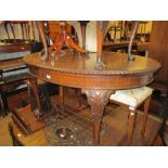 Small early 20th Century mahogany oval wind-out extending dining table,