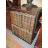 Early 20th Century oak revolving bookcase, housing a thirty six volume set Encyclopaedia Britannica,