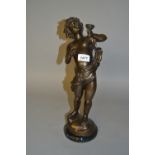 Reproduction dark patinated bronze figure of Bacchus on a marble plinth,