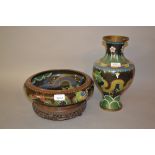 Large cloisonne circular shallow bowl decorated with dragons on a carved hardwood stand,