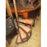 Reproduction mahogany set of library steps with leather inset treads raised on brass caps and