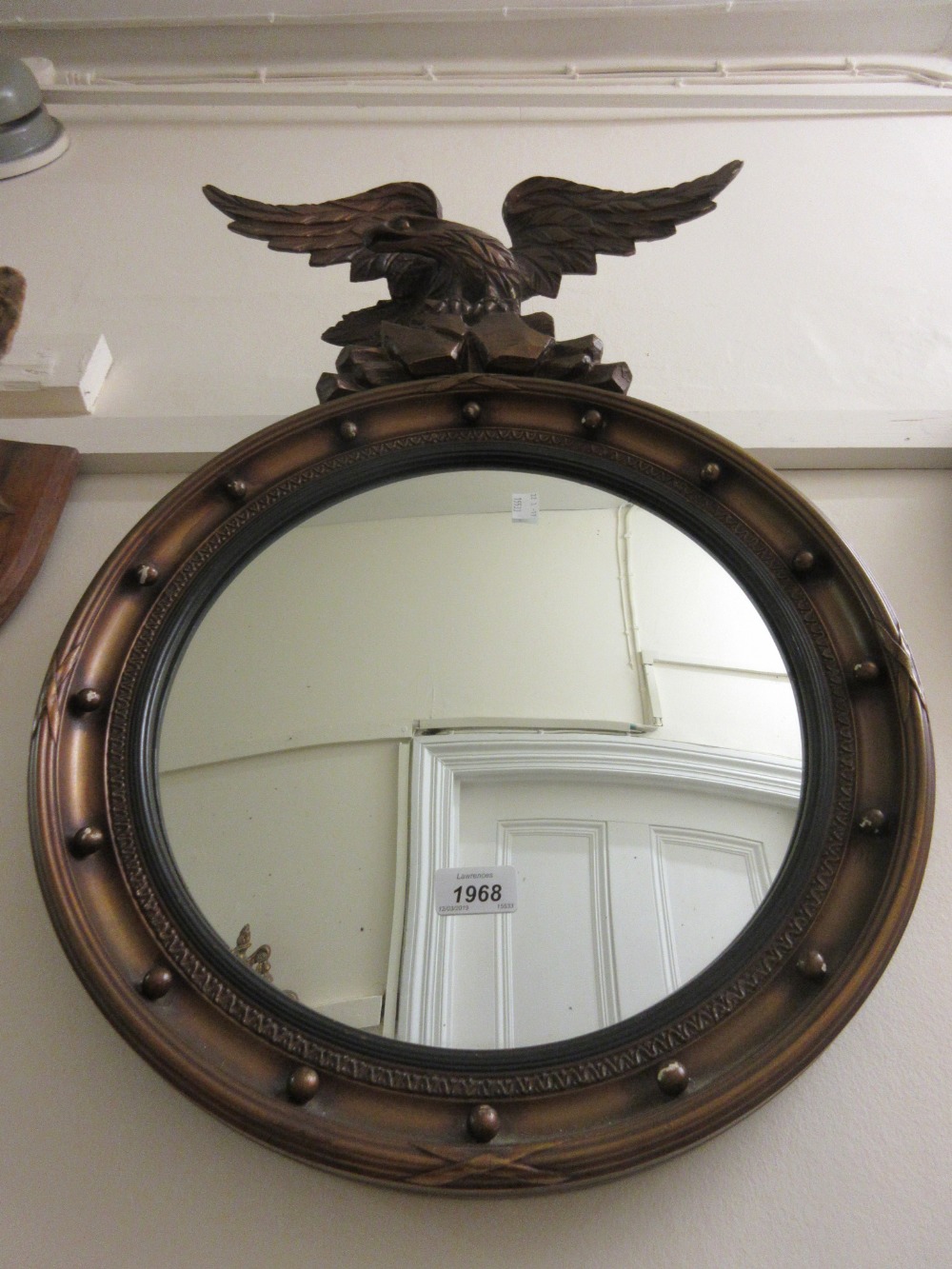 20th Century circular gilt convex ball pattern mirror with eagle surmount