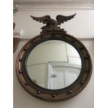 20th Century circular gilt convex ball pattern mirror with eagle surmount