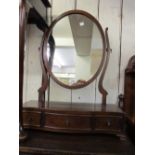 20th Century mahogany oval swing framed dressing table mirror with three jewel drawers on low ogee