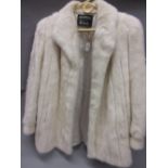 Ladies white fur half length fur coat by Grosvenor exclusive to Harrods,