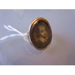 18th Century gold ring inset with an oval head and shoulder portrait of a gentleman