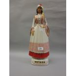 Italian Coronetti pottery decanter for Metaxa liqueur in the form of a lady in National costume