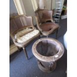 Pair of late 19th or early 20th Century French giltwood tub shaped salon chairs with cane backs and