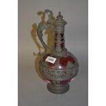 19th Century pewter and cranberry glass liqueur or claret jug in Renaissance style, 12.