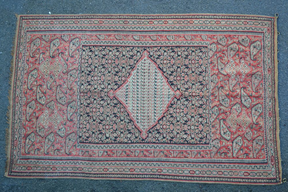Senneh Kelim rug with medallion and all-over stylised floral design and borders,