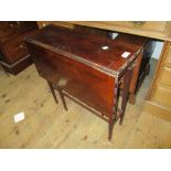 Edwardian mahogany Sutherland table on turned supports,