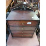 19th Century mahogany table top chest of four drawers with brass knob handles,