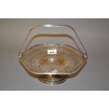 Hexagonal silver swing handled cake basket with pierced body,