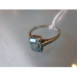 18ct White gold blue zircon set ring with diamond set shoulders