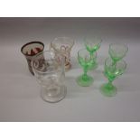 Set of four green tinted glass goblets, glass rummer,