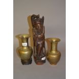 Pair of small Chinese bronze baluster form vases on hardwood stands,