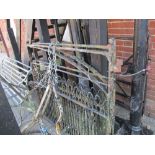 Pair of wrought iron garden gates together with large 6ft cast iron posts