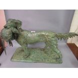 Large green patinated bronze figure of a retriever carrying a pheasant on a rectangular