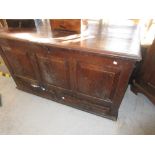 18th Century oak mule chest with a hinged cover above a three panel front with two drawers below