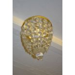 Small Edwardian gilt brass and cut glass bag form light fitting