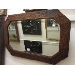 Early 20th Century octagonal carved oak bevelled edge wall mirror