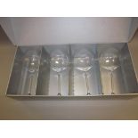 Pair of cut glass decanters with stoppers, boxed set of four Royal Doulton wine glasses,