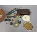 Small brown leather wallet containing a quantity of various military badges, compass,