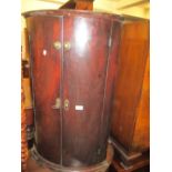 18th Century mahogany bow fronted two door hanging corner cabinet (at fault)