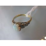 18ct Gold and opal set ring with stepped diamond set shoulders CONDITION REPORT 2.