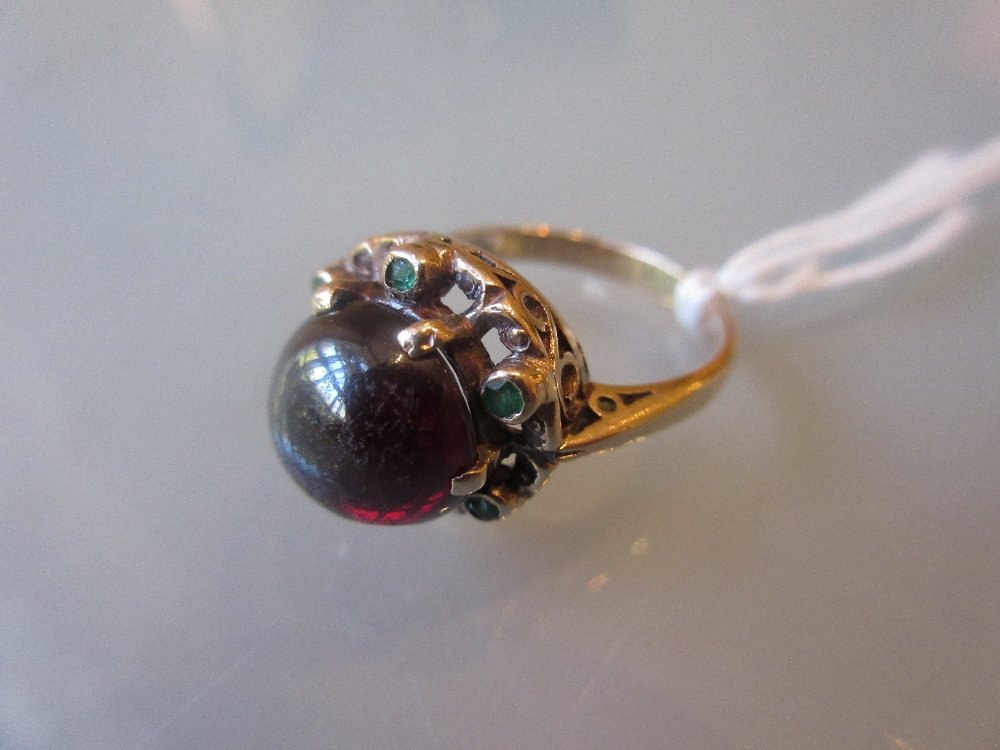 9ct Gold ring set cabochon garnet and six small emeralds CONDITION REPORT 4.