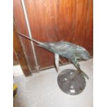 Contemporary green and dark patinated bronze figure of a leaping marlin on a circular marble plinth,