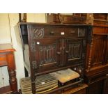 Oak drop-leaf side cabinet having single drawer and two linen fold carved panel doors with knob