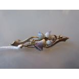 15ct Gold diamond and enamel bar brooch with central motif in the form of an orchid