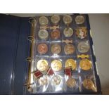 Album containing a collection of mainly Victorian and Edwardian school attendance medals,