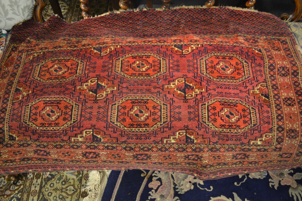 Early Tekke rug with two rows of three gols on a wine ground with multiple borders and skirt