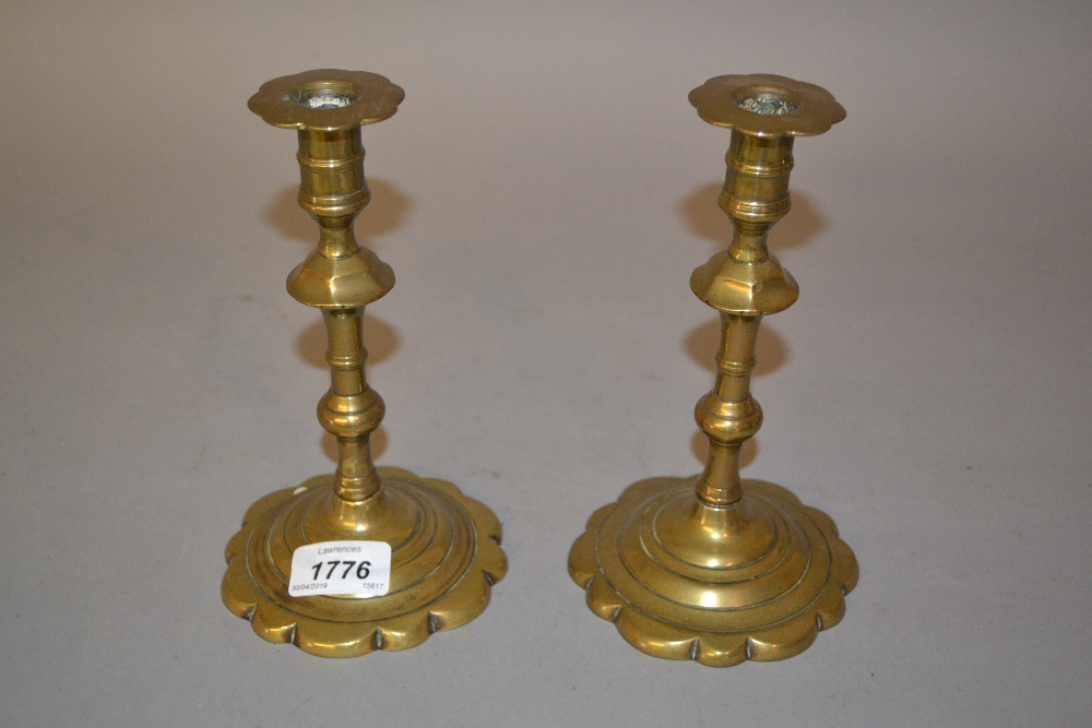 Pair of antique circular brass knopped stem candlesticks