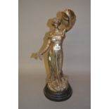Silvered spelter figural table lamp in the form of classical female holding a torch, 26ins high