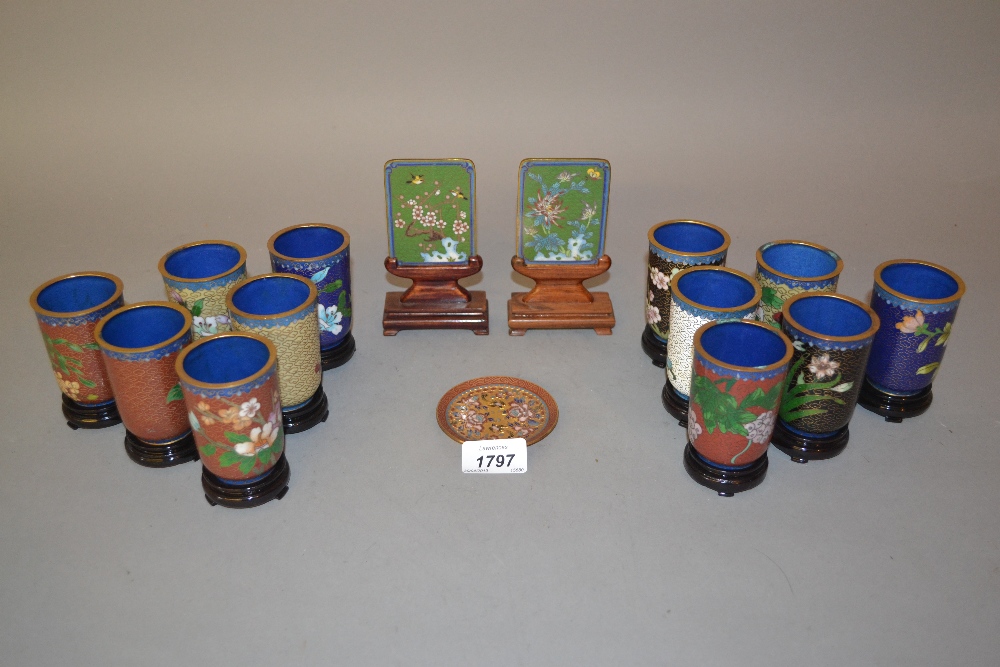 Pair of 20th Century cloisonne plaques on stands, pair of similar mother of pearl decorated