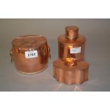 Two 19th Century copper tea caddies, the hinged covers inset with copper coins together with a