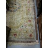 Chinese silk and woollen rug of all over floral design on a beige ground, 8ft x 5ft