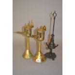 Pair of oriental brass and copper mounted oil lamps together with another Middle Eastern bronzed
