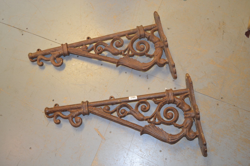 Pair of weathered cast iron wall brackets, each of right angled scroll design