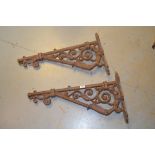 Pair of weathered cast iron wall brackets, each of right angled scroll design