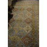 Indian Persian pattern woollen carpet of all-over floral design with multiple borders on a blue