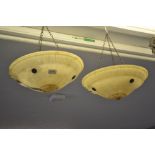 Pair of early 20th Century alabaster hanging shades with anodised copper fittings Unfortunately, one