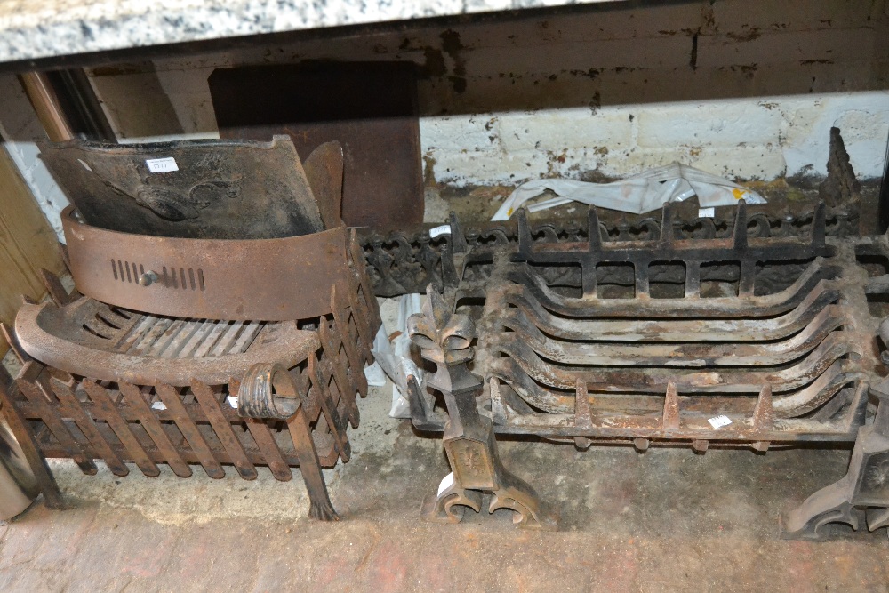 Cast iron fender, two grates and a pair of fire dogs