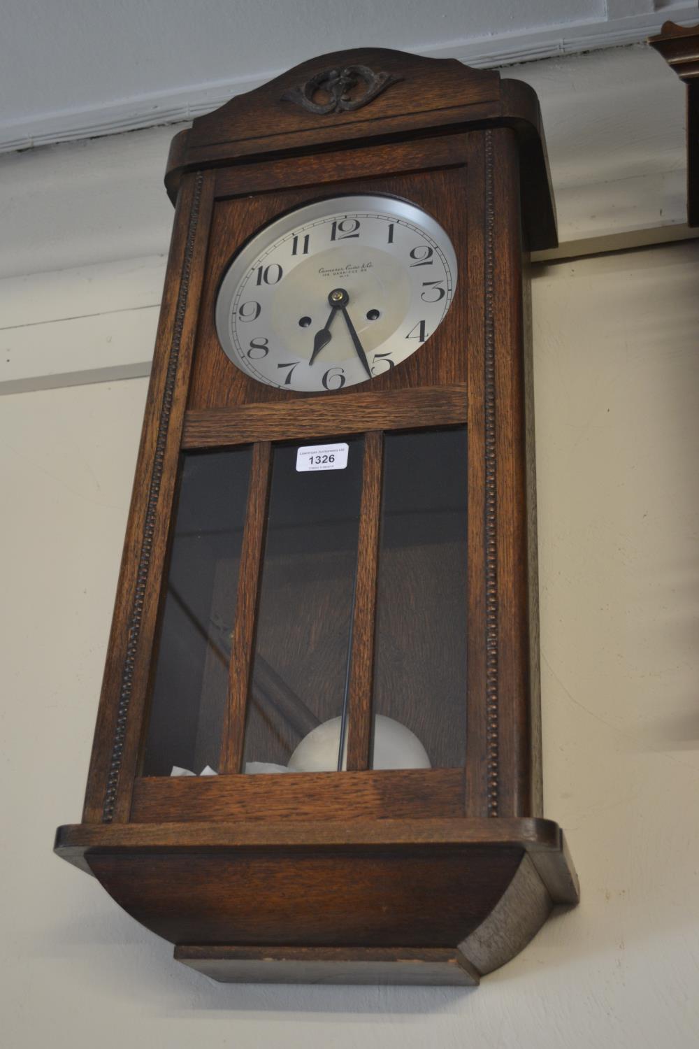 1920's Oak cased two train wall clock, the dial inscribed Camerer Cuss and Co., 186 Uxbridge Road,