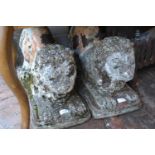 Pair of 20th Century cast concrete oriental style figures of lions with remnants of various paint